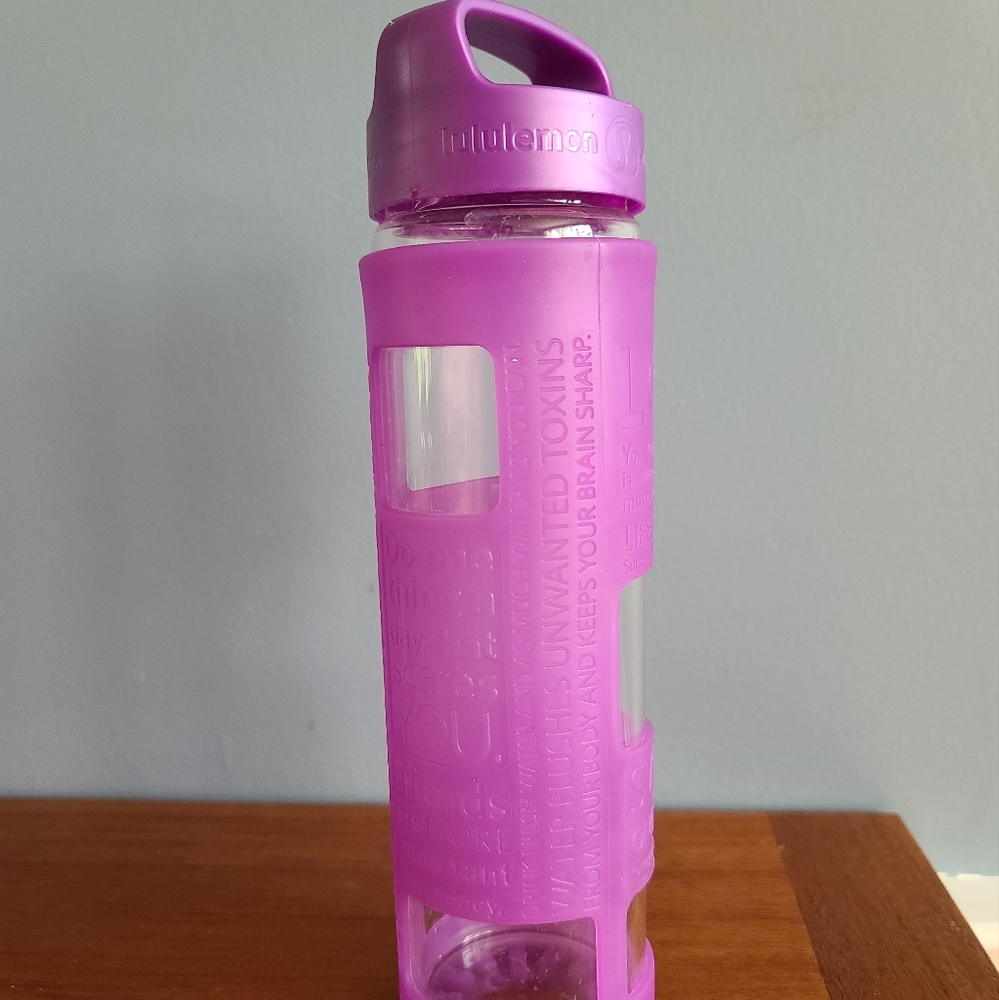 Lululemon glass water bottle with silicon sleeve